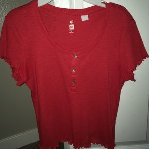 Me to We Red button crop.